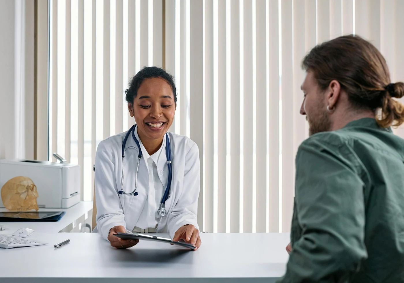 Doctor consulting with a patient in a clinical room