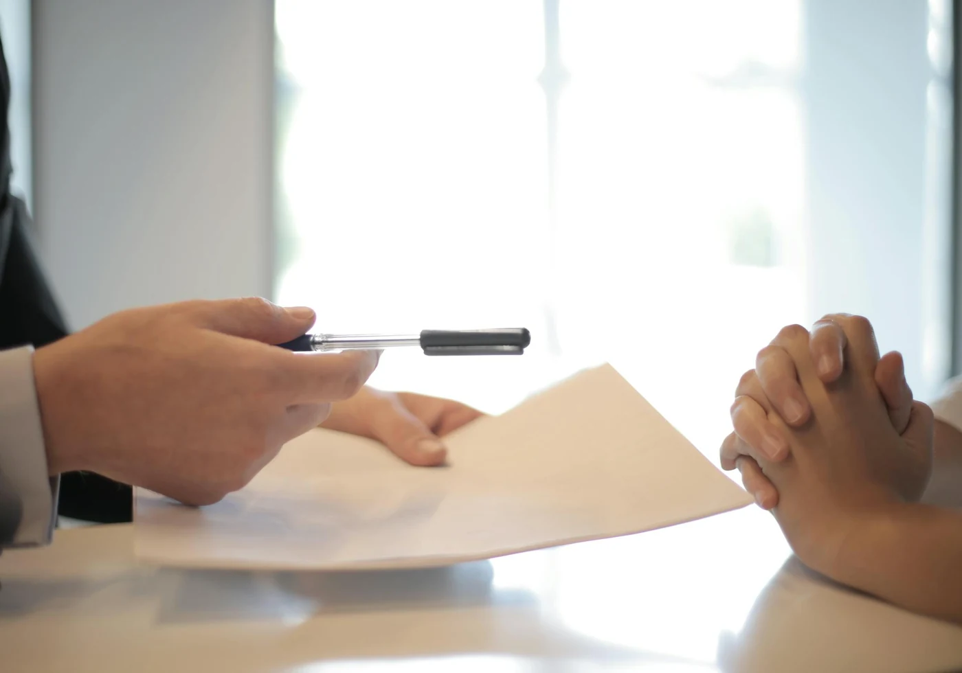 Business owner signing launch and compliance paperwork