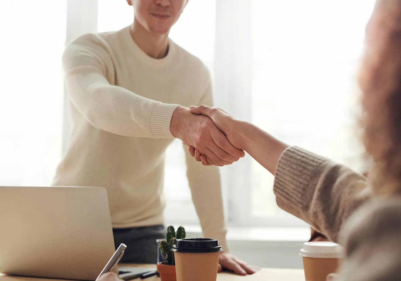 Final handover handshake after a business launch